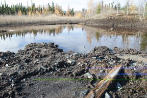 A pond at Hudbay's abandoned Spruce Point mine appears devoid of life. Photo by Eric Reder, Manitoba Wilderness Committee